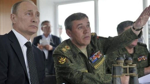 Russian Chief of Staff Valery Gerasimov [right] with President Vladimir Putin in an undated archive photo